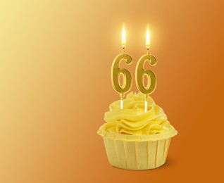 Image of Yummy cupcake with burning number shaped candles on orange gradient background, space for text. 66th birthday or other special occasion