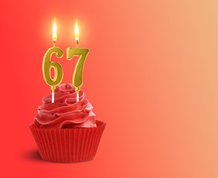 Image of Yummy cupcake with burning number shaped candles on red gradient background, space for text. 67th birthday or other special occasion