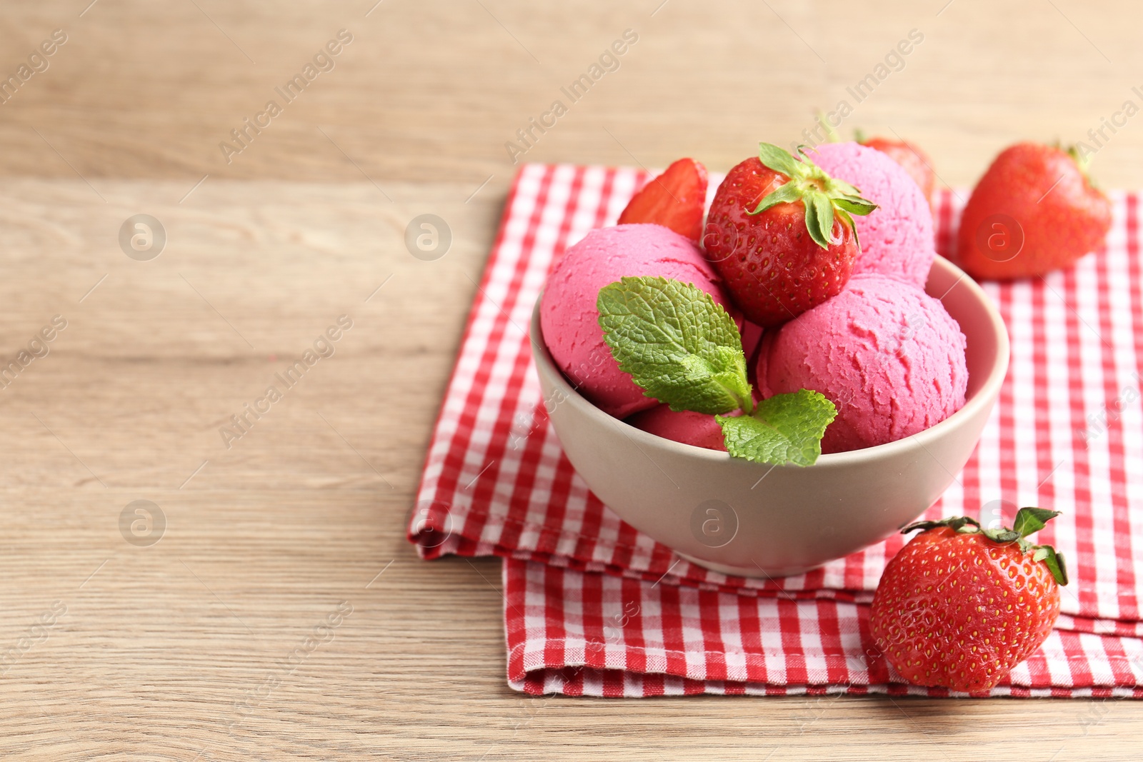Refreshing sorbet, strawberries and mint on wooden table, closeup. Space for text Photo of Refreshing sorbet, strawberries and mint on wooden table, closeup. Space for text
