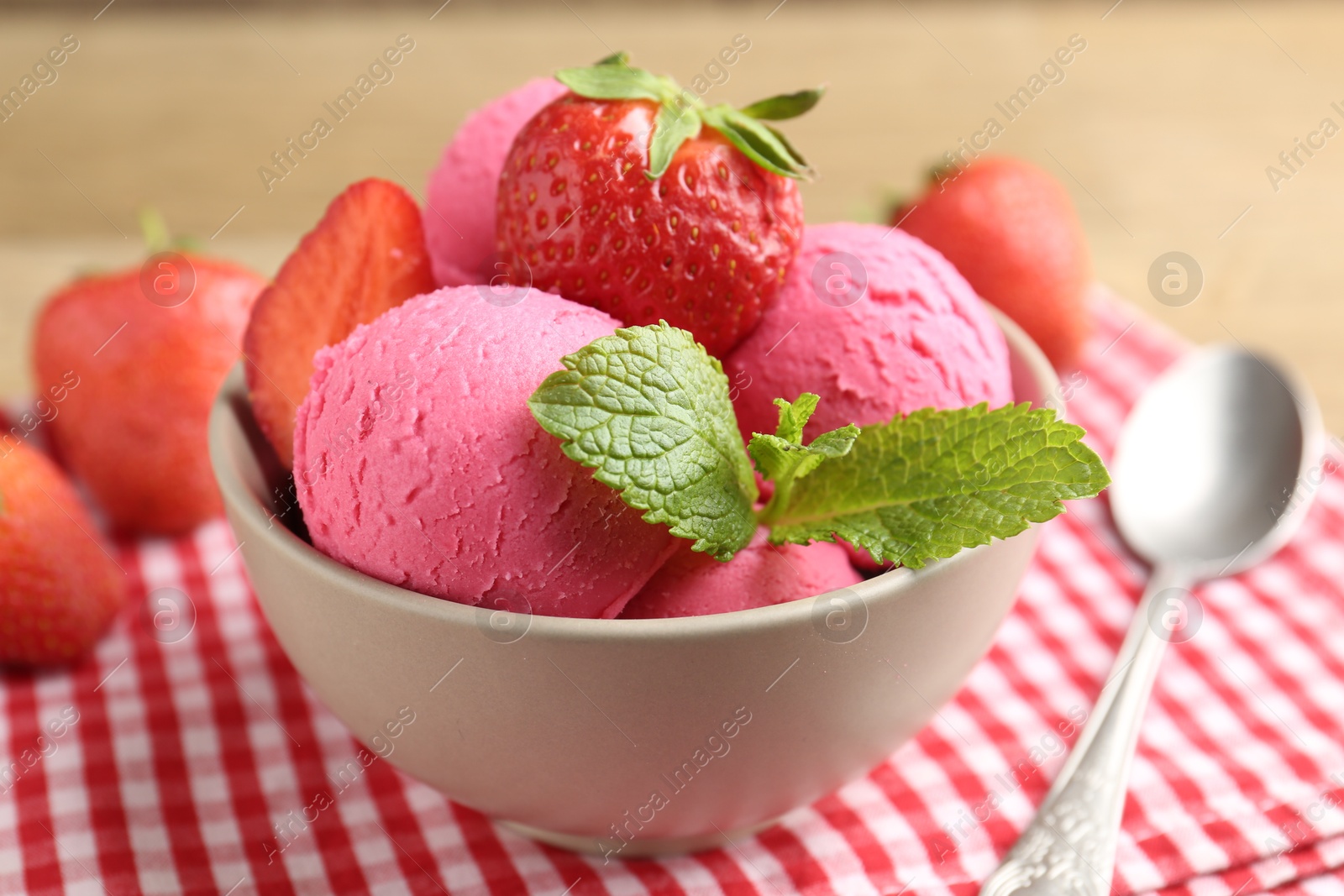 Refreshing sorbet, strawberries and mint on table, closeup Photo of Refreshing sorbet, strawberries and mint on table, closeup