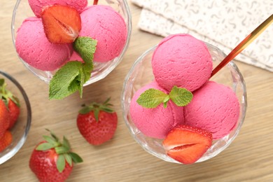 Photo of Refreshing sorbet, strawberries and mint on wooden table, flat lay