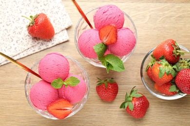Photo of Refreshing sorbet, strawberries and mint on wooden table, flat lay