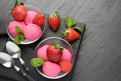 Photo of Refreshing sorbet, strawberries and mint on grey textured table, top view. Space for text