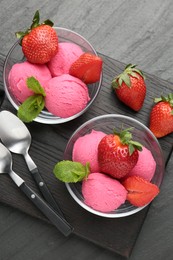 Photo of Refreshing sorbet, strawberries and mint on grey textured table, top view