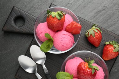 Photo of Refreshing sorbet, strawberries and mint on grey textured table, top view