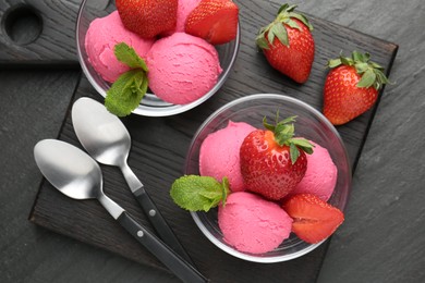 Photo of Refreshing sorbet, strawberries and mint on grey textured table, top view