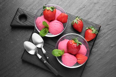 Photo of Refreshing sorbet, strawberries and mint on grey textured table, top view
