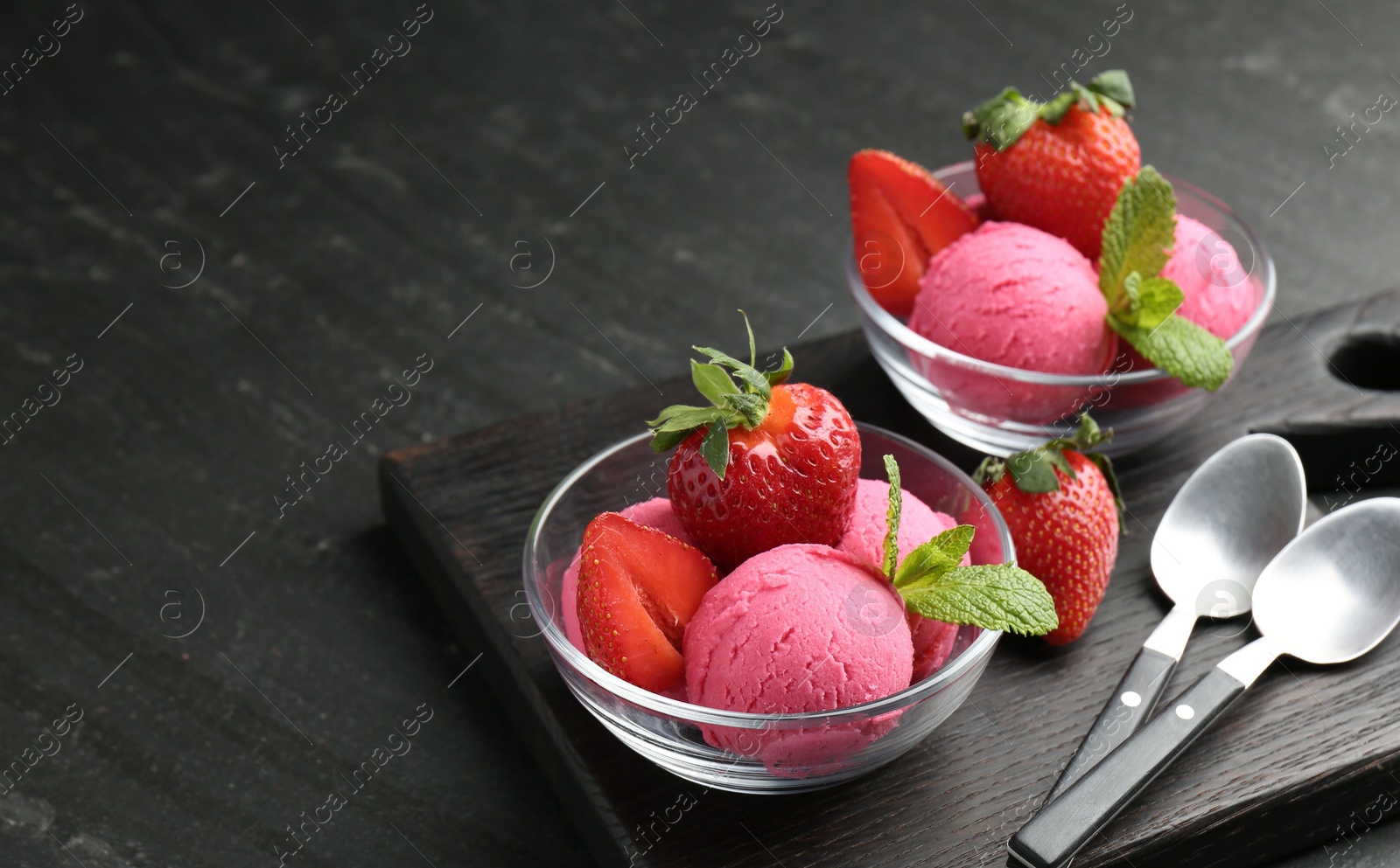 Refreshing sorbet, strawberries, mint and spoons on grey textured table, closeup. Space for text Photo of Refreshing sorbet, strawberries, mint and spoons on grey textured table, closeup. Space for text