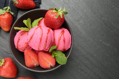 Photo of Refreshing sorbet with syrup, strawberries and mint in bowl on grey textured table, flat lay. Space for text