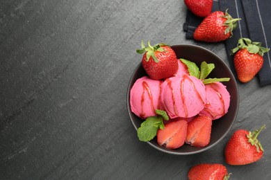 Photo of Refreshing sorbet with syrup, strawberries and mint in bowl on grey textured table, flat lay. Space for text