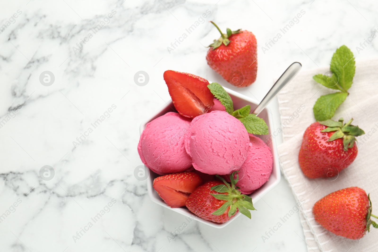 Refreshing sorbet, strawberries and mint in bowl on white marble table, flat lay. Space for text Photo of Refreshing sorbet, strawberries and mint in bowl on white marble table, flat lay. Space for text