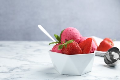 Photo of Refreshing sorbet, strawberries and mint in bowl on white marble table against grey background, closeup. Space for text