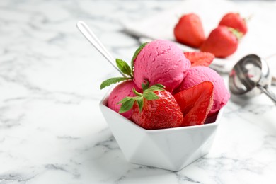 Photo of Refreshing sorbet, strawberries and mint in bowl on white marble table, closeup. Space for text