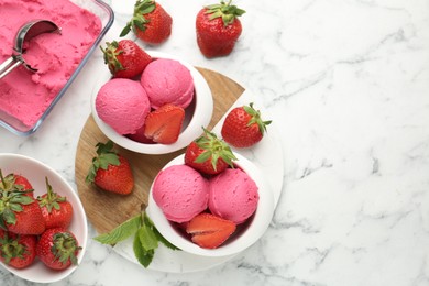 Photo of Refreshing sorbet, strawberries and mint on white marble table, flat lay. Space for text