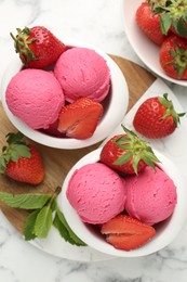Photo of Refreshing sorbet, strawberries and mint on white marble table, flat lay
