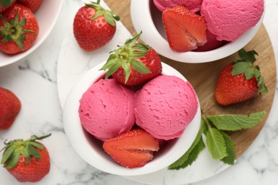 Photo of Refreshing sorbet, strawberries and mint on white marble table, flat lay