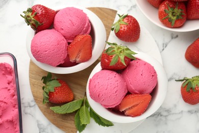 Photo of Refreshing sorbet, strawberries and mint on white marble table, flat lay