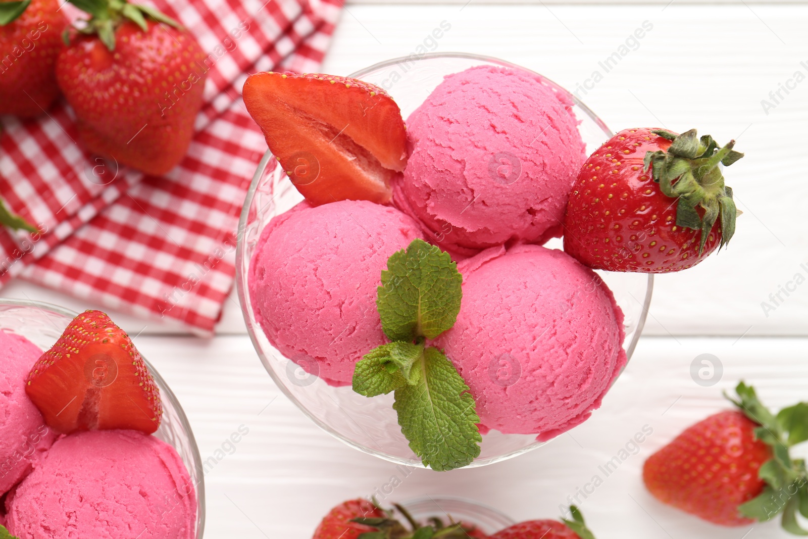 Refreshing sorbet, strawberries and mint on white wooden table, flat lay Photo of Refreshing sorbet, strawberries and mint on white wooden table, flat lay