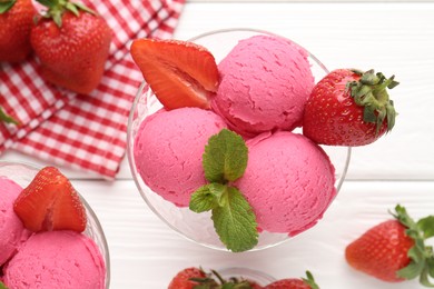 Photo of Refreshing sorbet, strawberries and mint on white wooden table, flat lay
