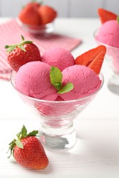 Photo of Refreshing sorbet, strawberries and mint in dessert bowl on white wooden table, closeup