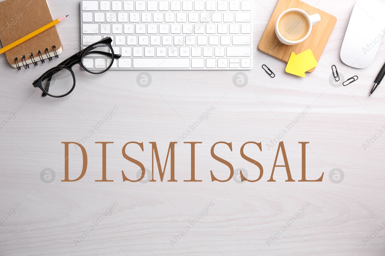 Word Dismissal, stationery, eyeglasses, computer keyboard and mouse on white wooden table, top view Image of Word Dismissal, stationery, eyeglasses, computer keyboard and mouse on white wooden table, top view