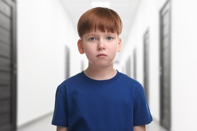 Image of Little boy in hallway of children's hospital