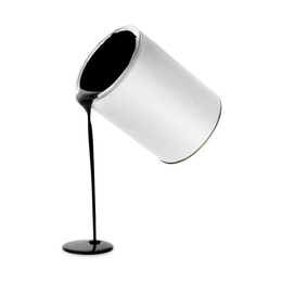 Image of Black paint pouring out of can on white background