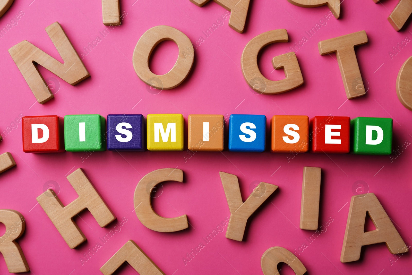Word Dismissed made of colorful cubes on pink background, top view Image of Word Dismissed made of colorful cubes on pink background, top view