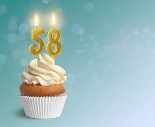 Image of Yummy cupcake with burning number shaped candles on light blue gradient background, space for text. 58th birthday or other special occasion