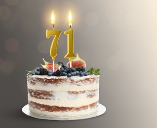 Image of Yummy cake with burning number shaped candles on grey gradient background, space for text. 71th birthday or other special occasion