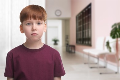 Image of Little boy in hallway of children's hospital