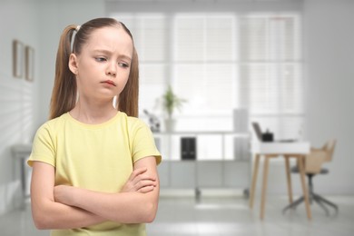 Image of Sad little girl in children's hospital. Space for text
