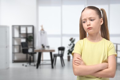 Image of Sad little girl in children's hospital. Space for text