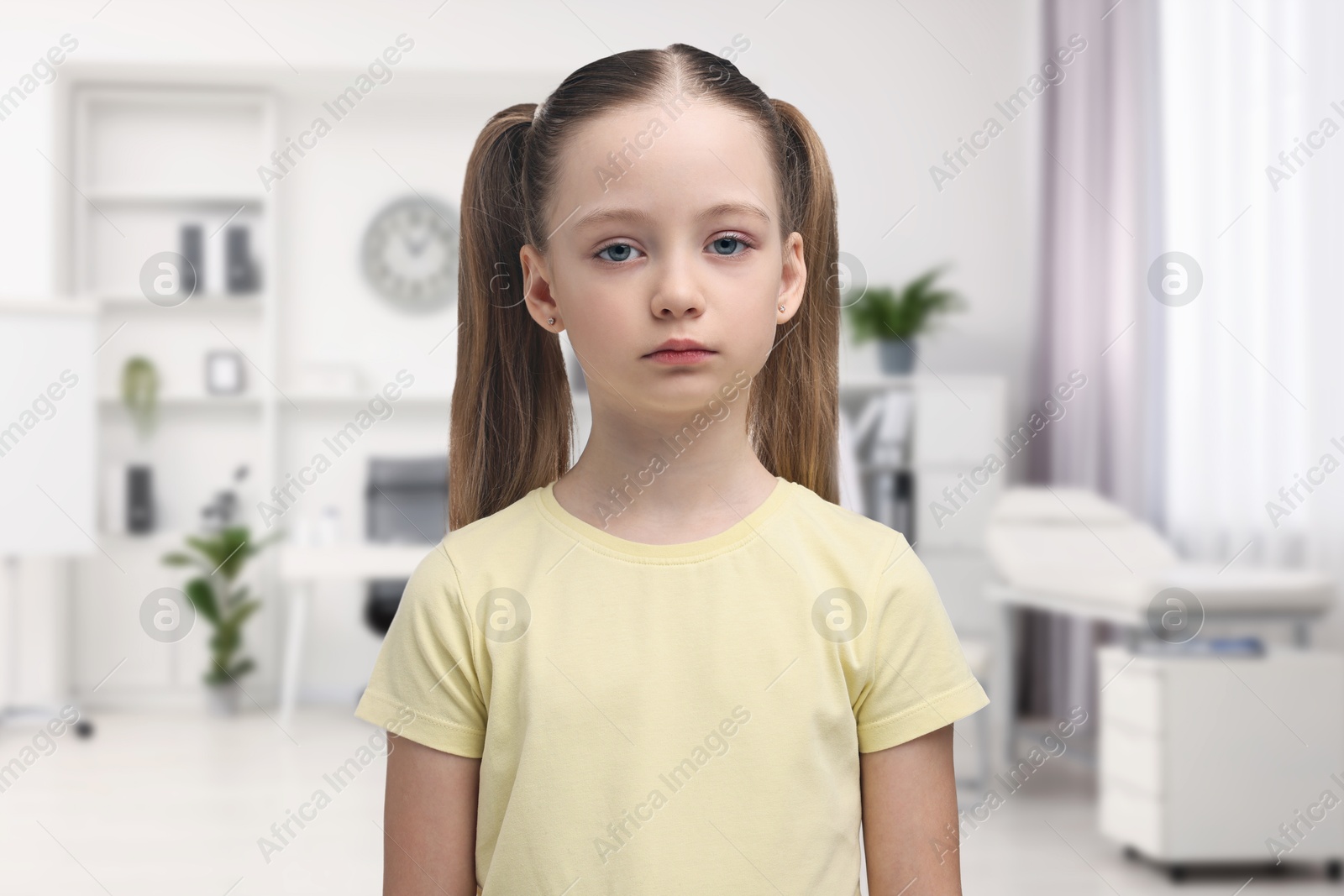 Image of Sad little child in pediatrician's office. Children's hospital