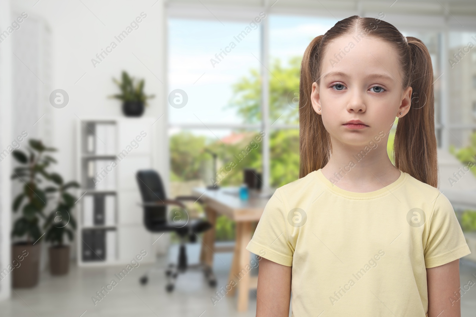 Image of Sad little girl in children's hospital. Space for text