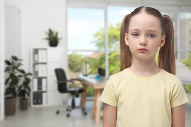 Image of Sad little girl in children's hospital. Space for text