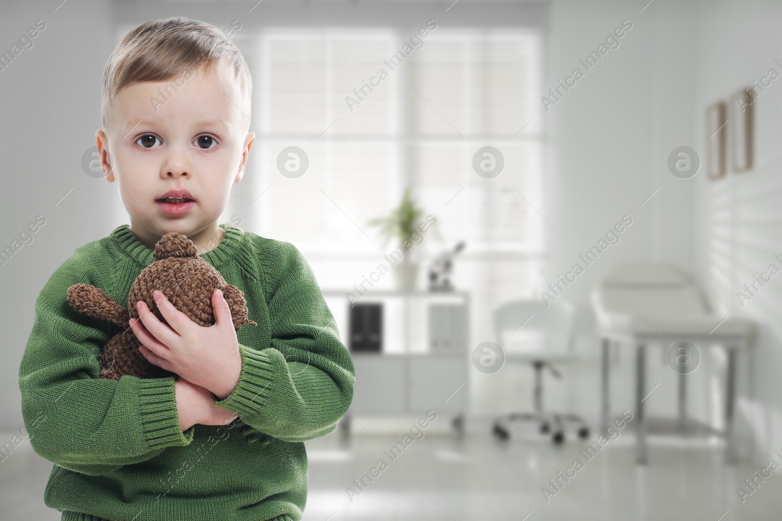 Cute little boy with toy bear in pediatrician's office. Children's hospital Image of Cute little boy with toy bear in pediatrician's office. Children's hospital