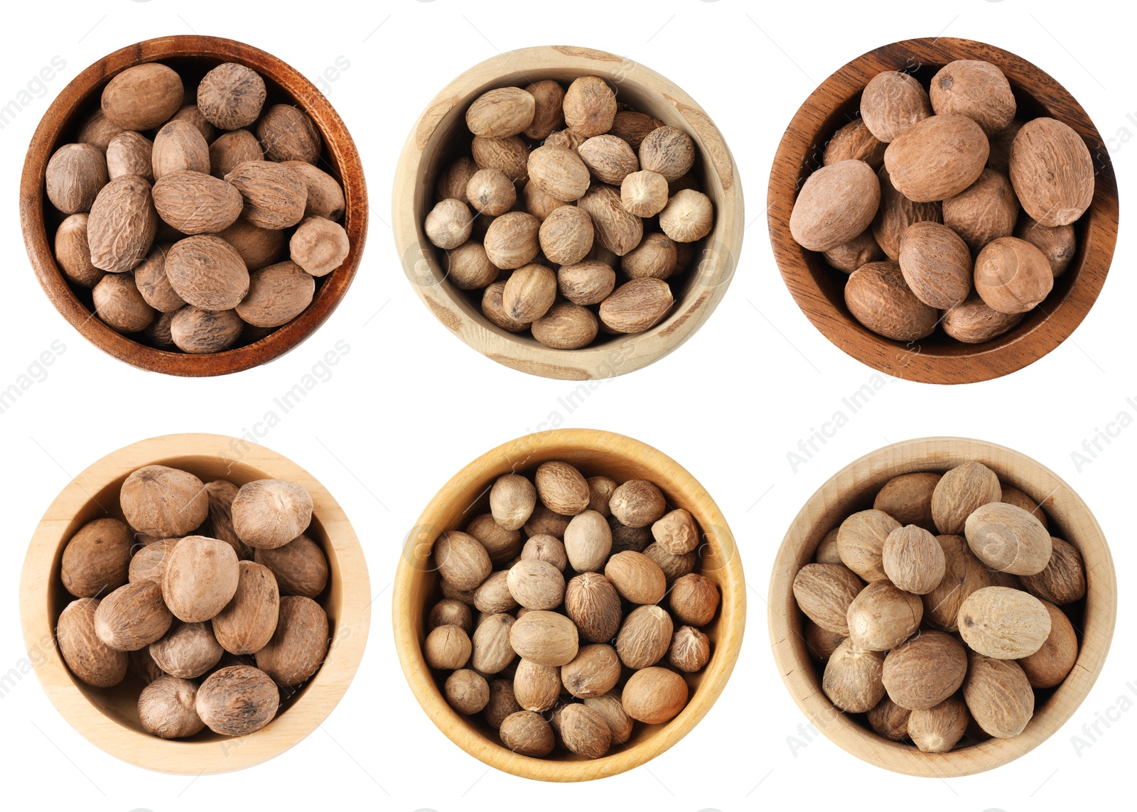 Nutmeg seeds in bowls on white background, set. Top view Image of Nutmeg seeds in bowls on white background, set. Top view