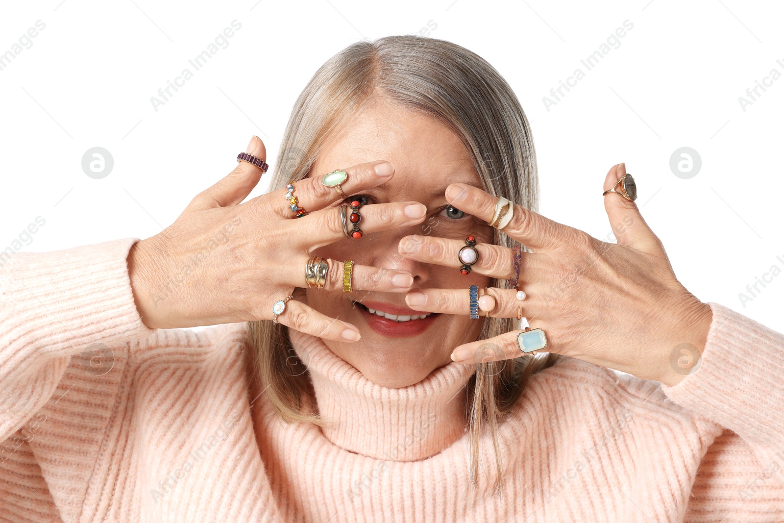Photo of Senior woman wearing different rings on white background