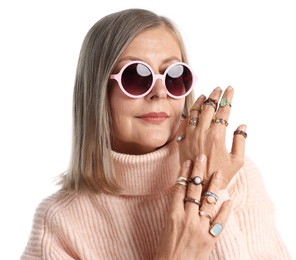 Photo of Senior woman wearing different rings on white background