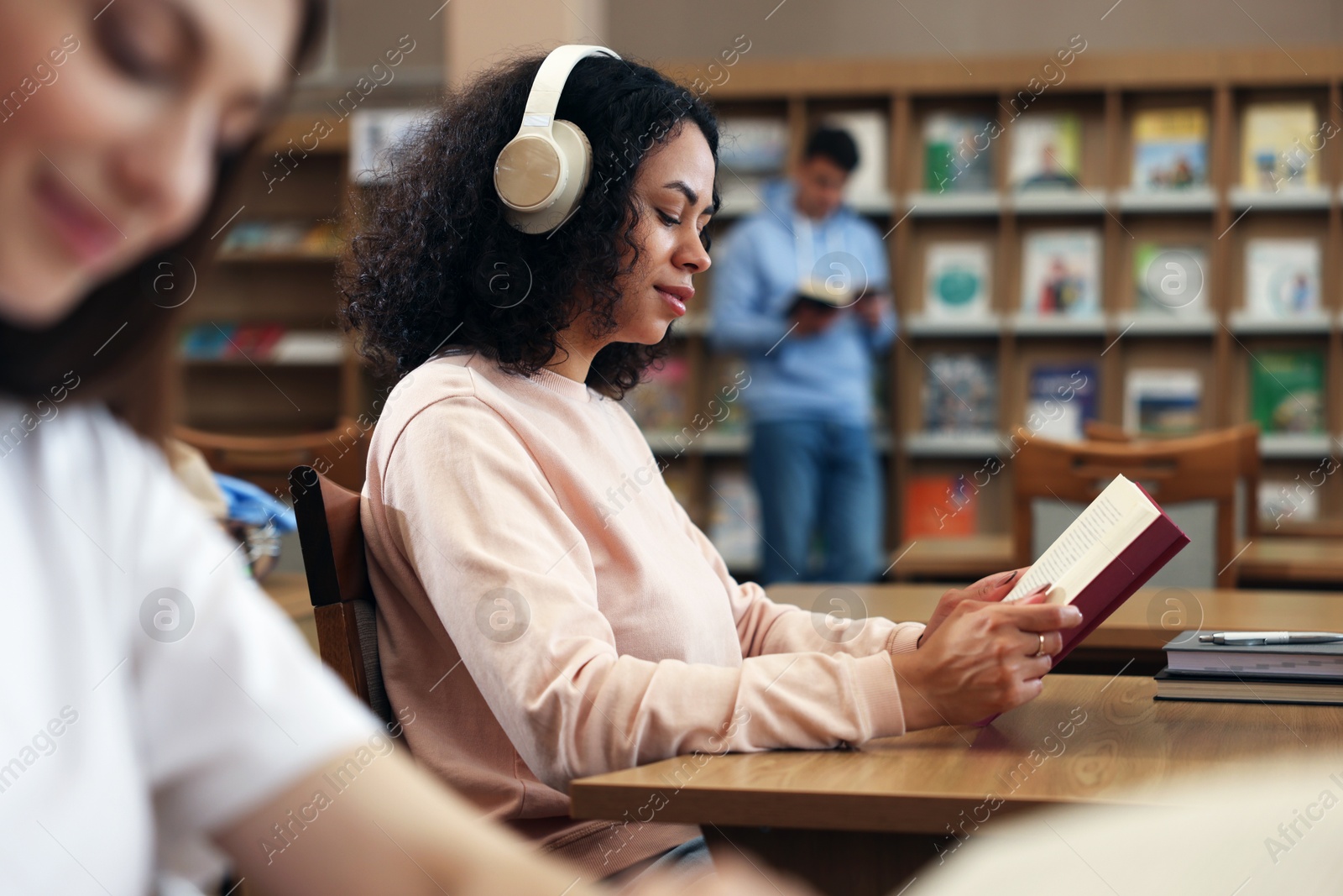 People studying in public library, selective focus Photo of People studying in public library, selective focus