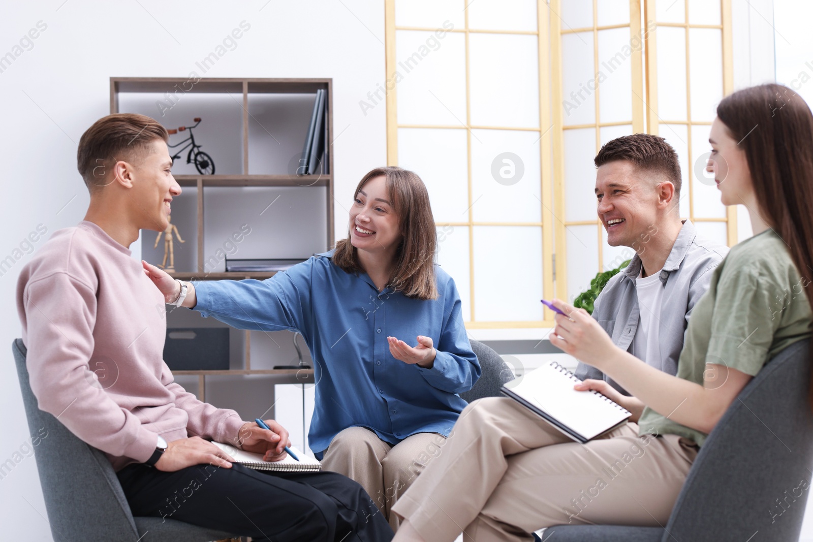 Group of people having meeting during life coaching class indoors Photo of Group of people having meeting during life coaching class indoors
