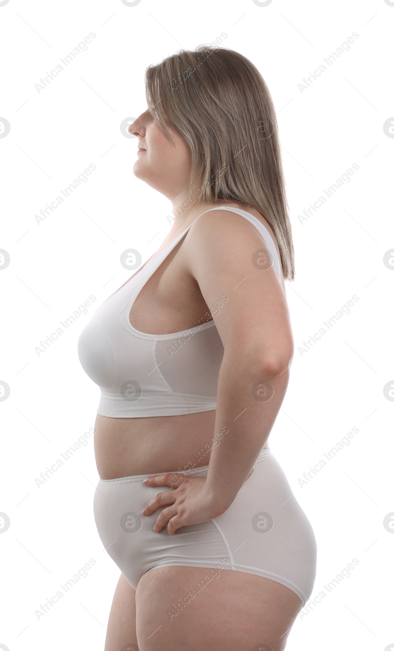 Weight loss. Plus size woman in underwear on white background Photo of Weight loss. Plus size woman in underwear on white background
