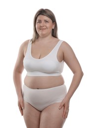 Photo of Weight loss. Plus size woman in underwear on white background