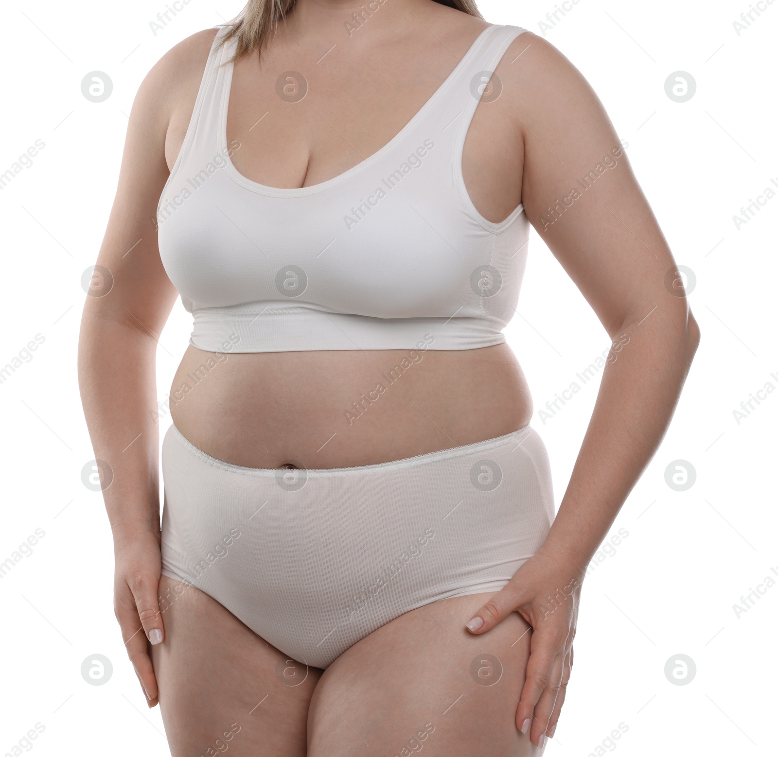 Weight loss. Plus size woman in underwear on white background, closeup Photo of Weight loss. Plus size woman in underwear on white background, closeup