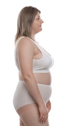 Photo of Weight loss. Plus size woman in underwear on white background