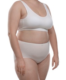 Photo of Weight loss. Plus size woman in underwear on white background, closeup