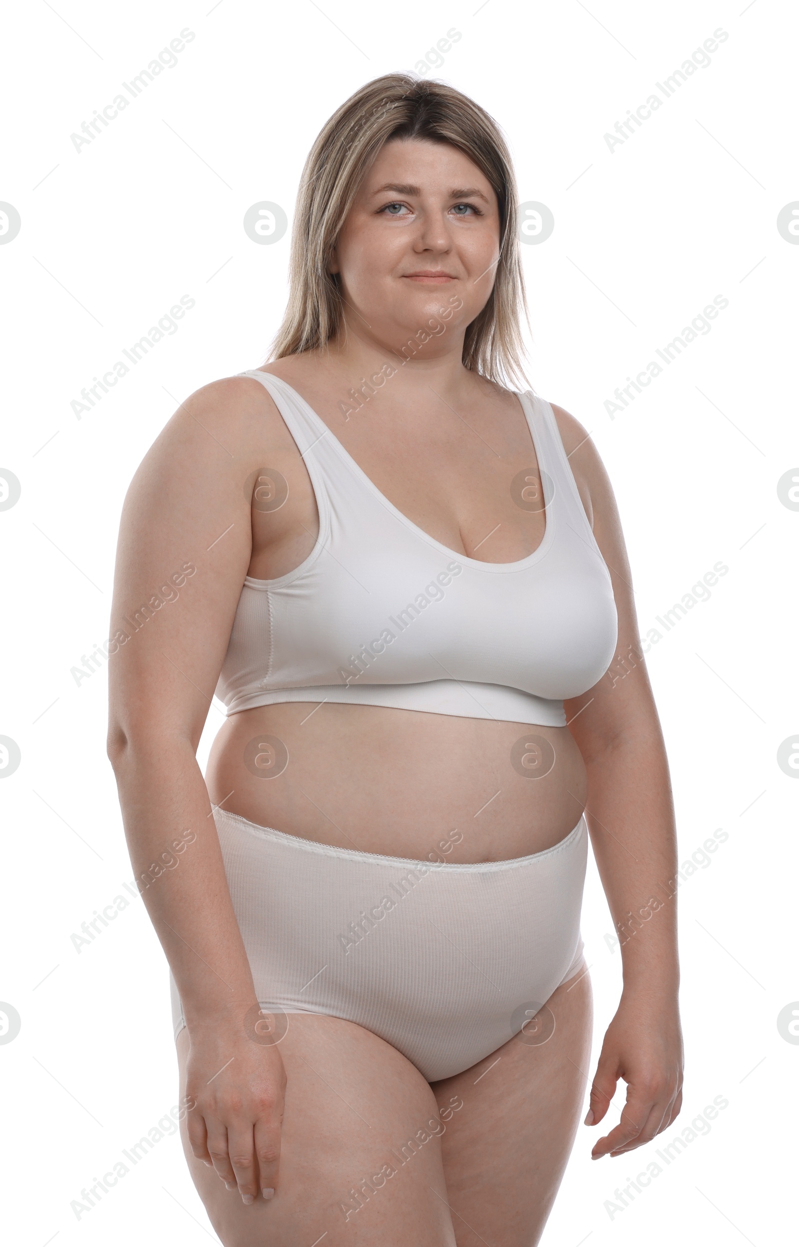 Weight loss. Plus size woman in underwear on white background Photo of Weight loss. Plus size woman in underwear on white background