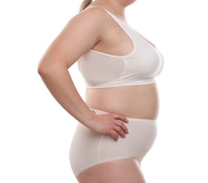 Photo of Weight loss. Plus size woman in underwear on white background, closeup