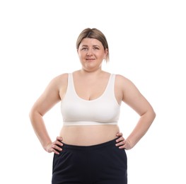 Photo of Weight loss. Plus size woman in underwear on white background
